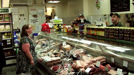 Woman (Dee) ordering at a deli