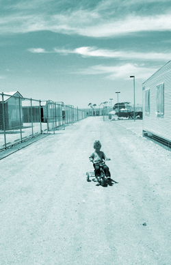 A child riding a trike at Woomera