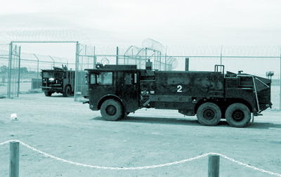 Image: Blue fire trucks sitting outside Woomera, June 2002