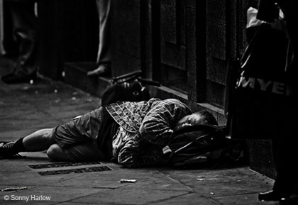 A homeless man sleeping on the street