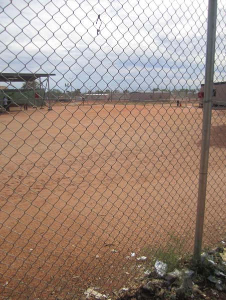 Looking through internal fence into activities compound, Curtin IDC