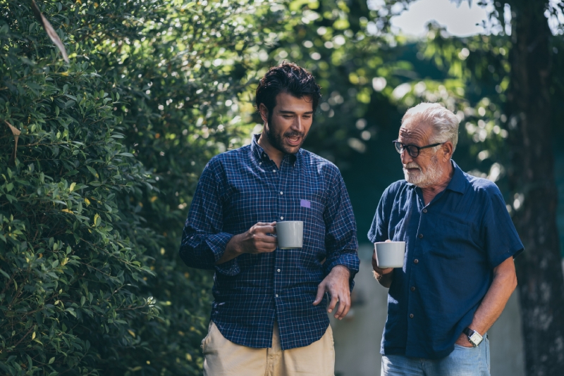 Two men in conversation one older and one younger