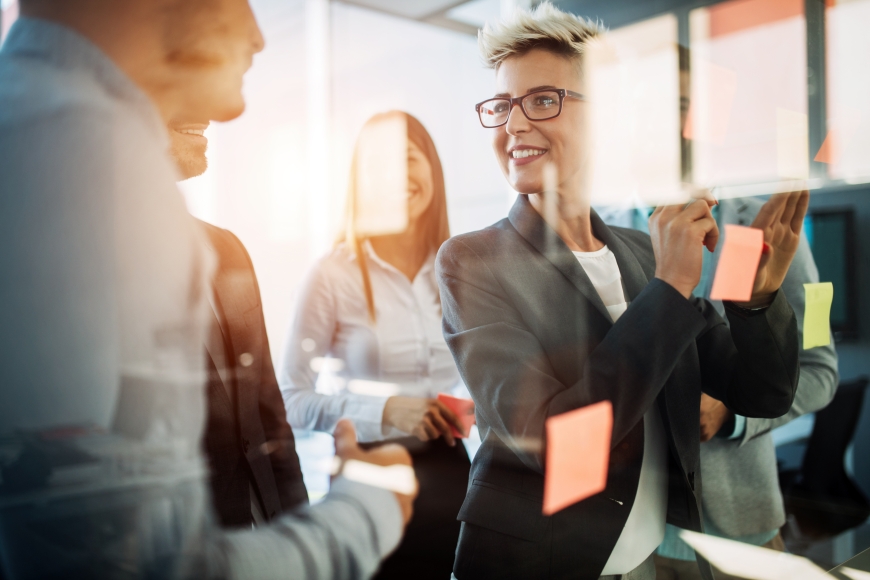 Diverse group of business people planning strategy in office together