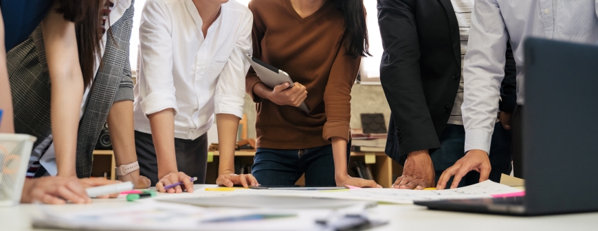 Diverse group of business people meeting in modern office