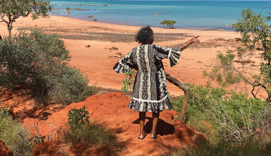 First Nations woman looks out to sea