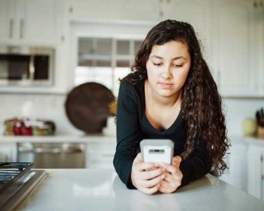 Young woman looking at phone