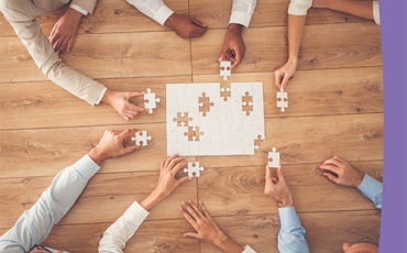 Respect@Work community Guide - cover image of workers hands assembling a jigsaw