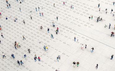 Crowd walking over binary code