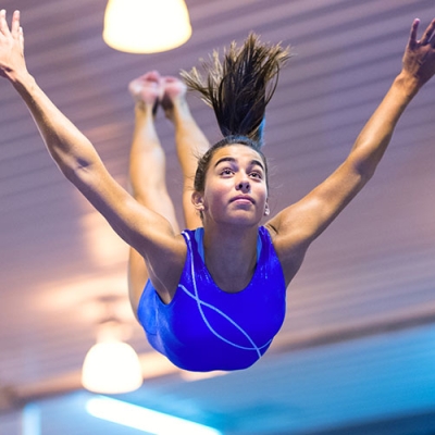 gymnast leaping through the air