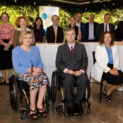 Senior Leaders at the Forum in front of the AHRC banner and plant wall. In the front row is COmmissioner Gauntlett, Jane Spring and Minister Rishworth  