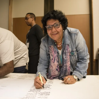 Commissioner June Oscar AO signing the uluru statement from the heart