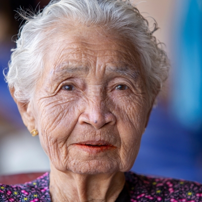 Elderly lady of Asian heritage.