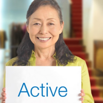 older woman with a sign "Active"